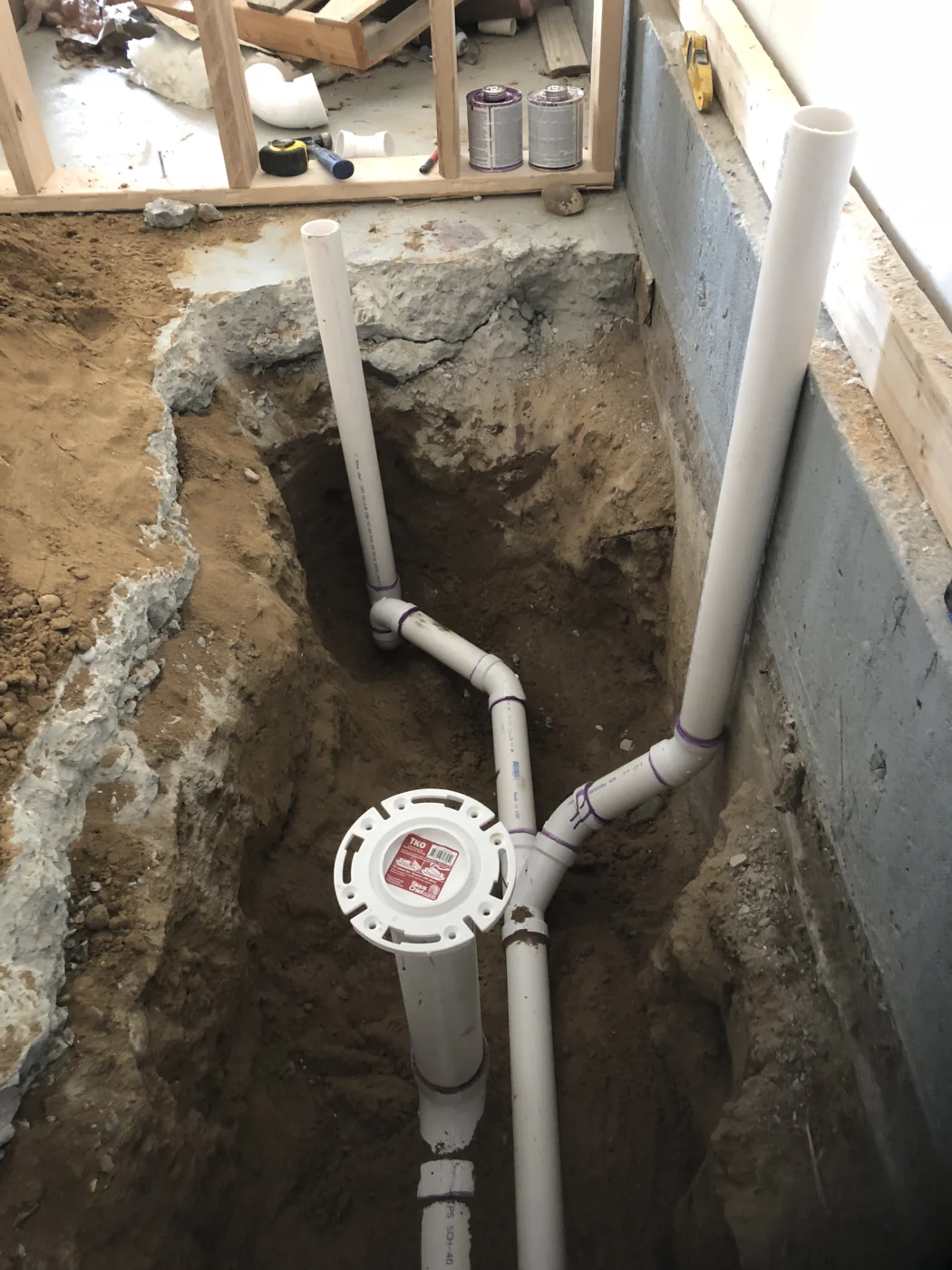 Framed interior wall with venting and plumbing work during a remodel
